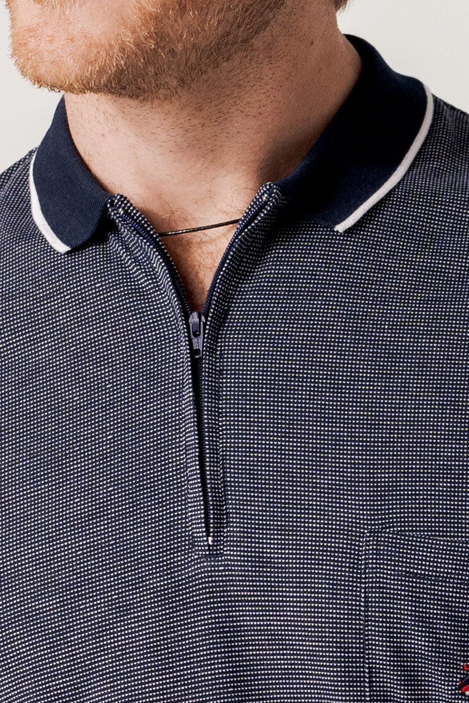 Polo jacquard marino manga corta cuello cremallera